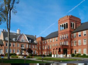 Robotic mower operating quietly on school agrounds before recess